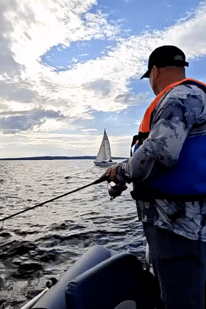 Sailing and fishing on a grey afternoon near Chaykovsky