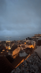 Evening observations capture Lisbon's rooftops and street scenes
