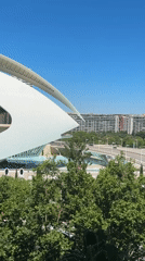 Witnesses document Valencia's futuristic architecture complex on sunny afternoon