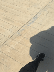 Morning stroll captured on Batumi's seaside boardwalk