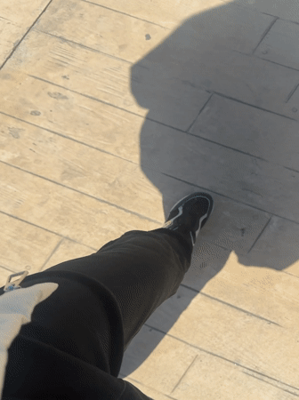 Morning stroll captured on Batumi's seaside boardwalk