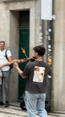 Street performers draw crowds in historic Porto, Portugal