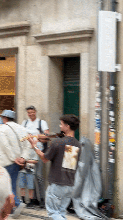 Street performers draw crowds in historic Porto, Portugal