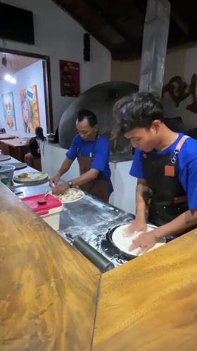 Pizza being made at a rustic Karimunjawa restaurant