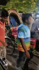 Night street market bustles with food vendors in Dhaka