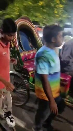 Night street market bustles with food vendors in Dhaka
