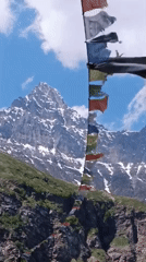 Prayer flags and snow peaks in the high Himalayas