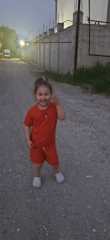 Children play outdoors in separate nearby locations