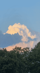 Golden sunset clouds billowing over Singen, Germany