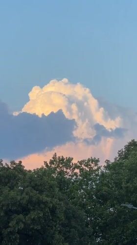Golden sunset clouds billowing over Singen, Germany