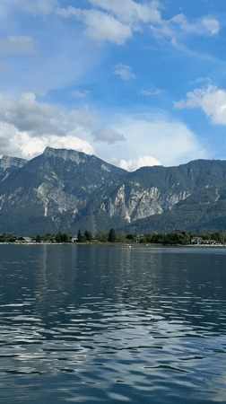 Summer afternoon on Lake Calceranica: boats, kayaks, and a wet dog