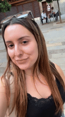 Woman films herself walking outdoors in Barcelona
