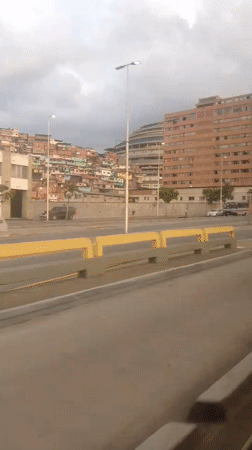 Evening drive through Caracas captures urban landscape views