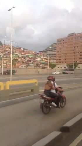 Evening drive through Caracas captures urban landscape views