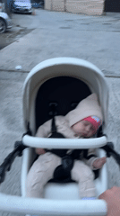 Mother documents afternoon stroll with baby through Sochi neighborhood