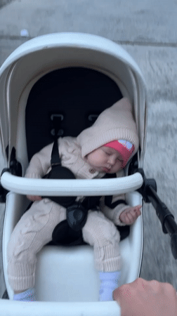 Mother documents afternoon stroll with baby through Sochi neighborhood