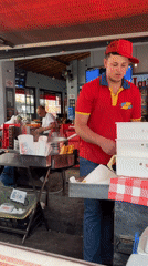Street food vendors serve customers in São Paulo