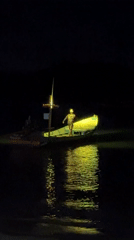Green-lit boat spotted at night near Koh Phangan