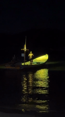 Green-lit boat spotted at night near Koh Phangan