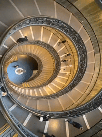 Tourist documents Vatican Museums visit with staircase photography, selfies