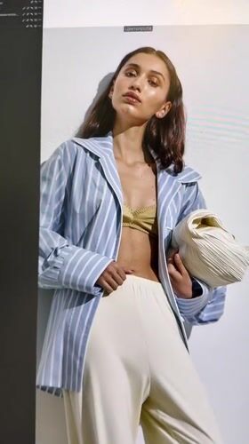 Moscow studio fashion shoot, white wardrobe, crew in background