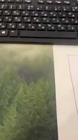 The video begins with a close-up of a black keyboard, a mousepad with a forest image, and a sheet of paper with some handwritten notes. The camera then pans up to show a computer monitor displaying a video editing interface. The camera shifts perspective and a young person wearing a black t-shirt with a red graphic is seen. They hold the camera in a selfie position, showing their face and then moving the camera downwards to display the desk setup again. The desk has various items, including pens, papers, and a calculator, arranged haphazardly. The video ends with the camera pointed towards the wall, briefly showing a colorful assortment of markers on a shelf.
