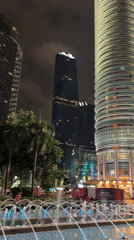 Nighttime Views of Illuminated Petronas Twin Towers Captured in Kuala Lumpur