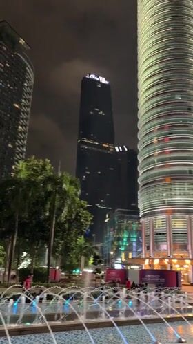 Nighttime Views of Illuminated Petronas Twin Towers Captured in Kuala Lumpur