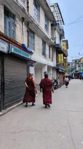 Morning scenes captured in Dharamkot: monks, delivery truck, dining