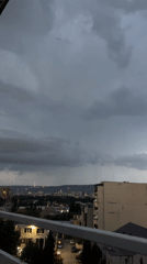 USA vs. Australia soccer match, storm rolling in over the city