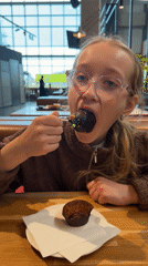 Woman dines at buffet restaurant in Ulbroka, Latvia