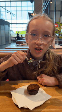Woman dines at buffet restaurant in Ulbroka, Latvia
