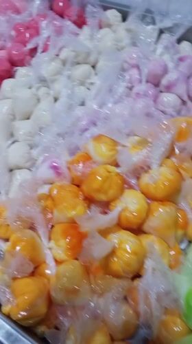 Street vendors sell colorful treats in Tinaquillo, Venezuela
