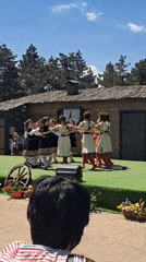 Folk dancers perform traditional dance outdoors in Sofia, Bulgaria