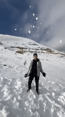 Residents enjoy rare snowfall, play on hillside in Tallfita, Syria