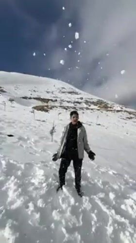 Residents enjoy rare snowfall, play on hillside in Tallfita, Syria