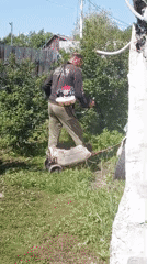 Late-night lawn care work documented in Artyom, Russia