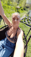Woman documents outdoor cooking session in Yelizovo, Russia