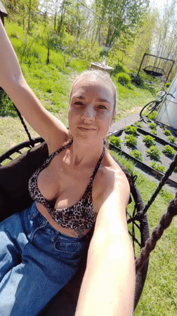 Woman documents outdoor cooking session in Yelizovo, Russia