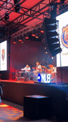 Live band plays a lit stage in Tivat on a summer evening