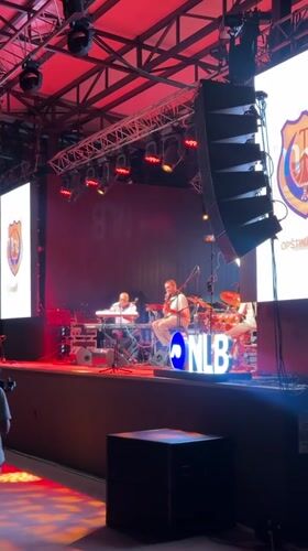 Live band plays a lit stage in Tivat on a summer evening