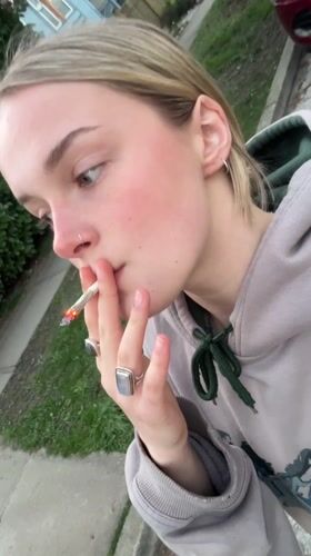 Woman smoking cigarette observed in Vancouver early morning