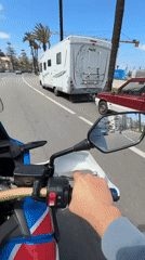 Motorcyclist travels through sunny Tangier streets, Morocco