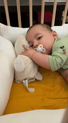 Baby in Disney onesie observed in nursery crib