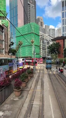 Morning tram operations and pedestrian activity observed in Hong Kong