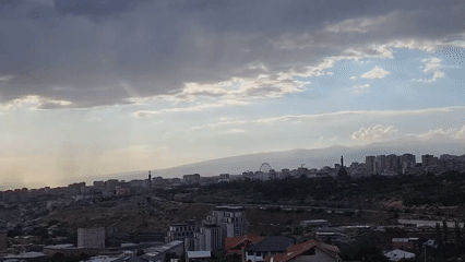 Yerevan from above, dramatic skies and a sleeping dog
