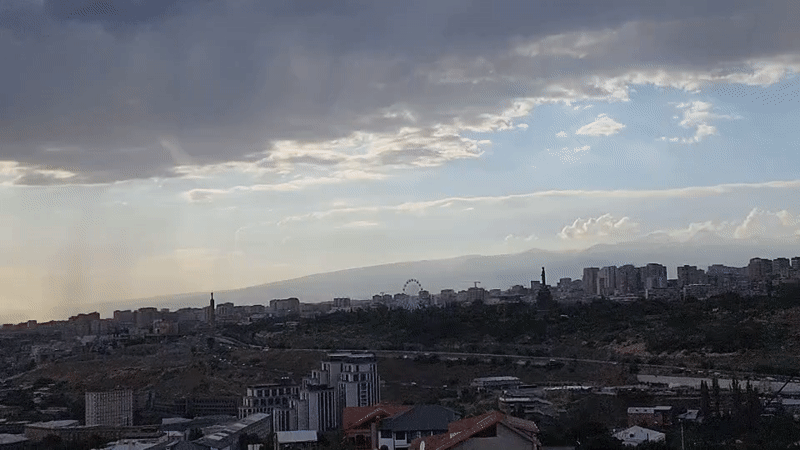 Yerevan from above, dramatic skies and a sleeping dog