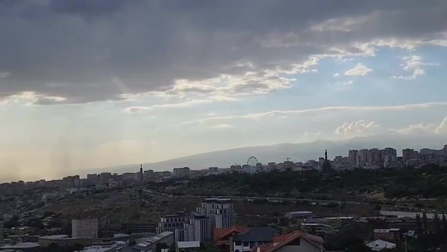 Yerevan from above, dramatic skies and a sleeping dog
