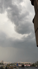 Stormy city skyline from above, overcast and closing in