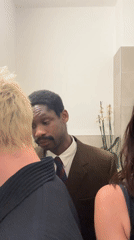 Three people gather in London bathroom, music playing